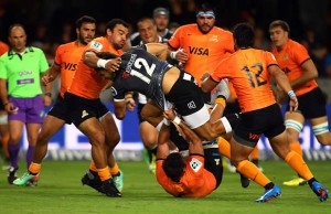 Andre Esterhuizen is tackled by the Jaguares defence
