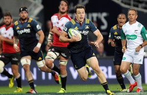 Ben Smith of the Highlanders attempts to break the Lions