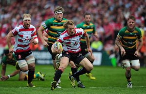 Billy Twelvetrees tries to evade the Northampton defence