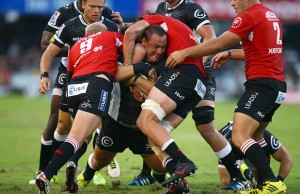 Coenie Oosthuizen gets wrapped up by the Lions defence