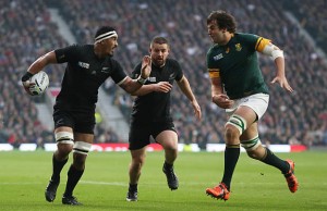 Jerome Kaino fends off a tackle on his way to the tryline