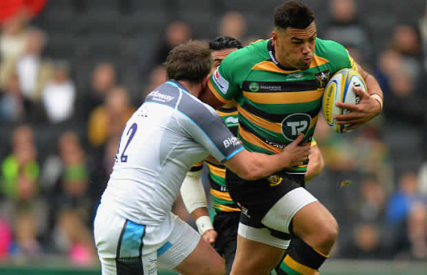 Luther Burrell fends off a tackle for Northampton Saints