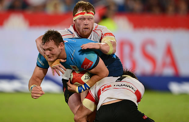 Jacques van Rooyen of the Lions tackles Roelof Smit of the Blue Bulls
