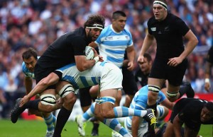 Sam Whitelock gets pushed back in the tackle