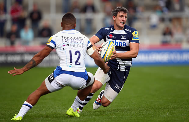 Tom Brady looks to move the ball for Sale Sharks