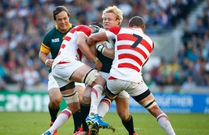 Adriaan Strauss gets wrapped up by the Japanese defence