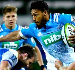 George Moala of the Blues attempts to break from a tackle