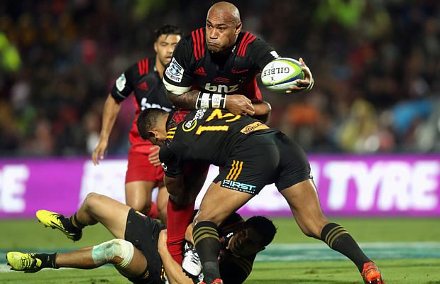 Nemani Nadolo of the Crusaders is tackled by Seta Tamanivalu of the Chiefs