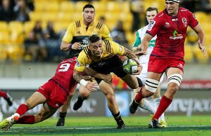 TJ Perenara is tackled by Nick Frisby
